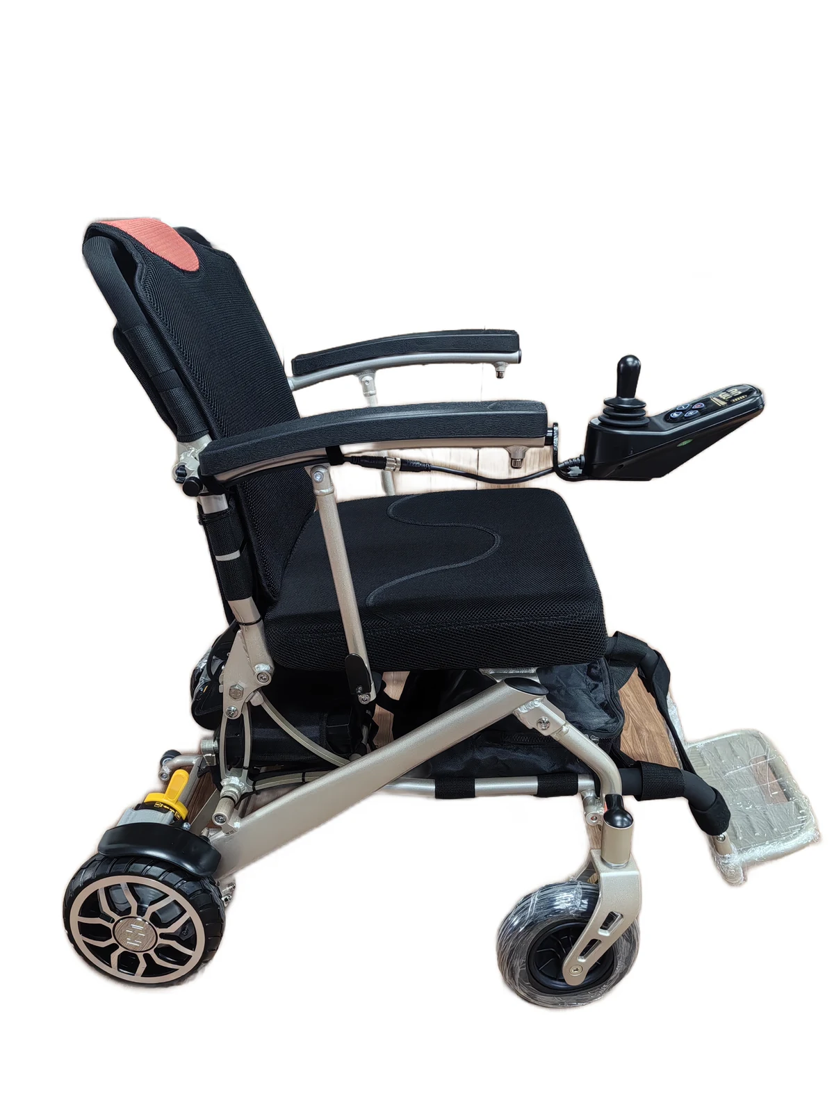 EW100 lightweight aluminum electric wheelchair, side view showing rose gold aluminum alloy frame