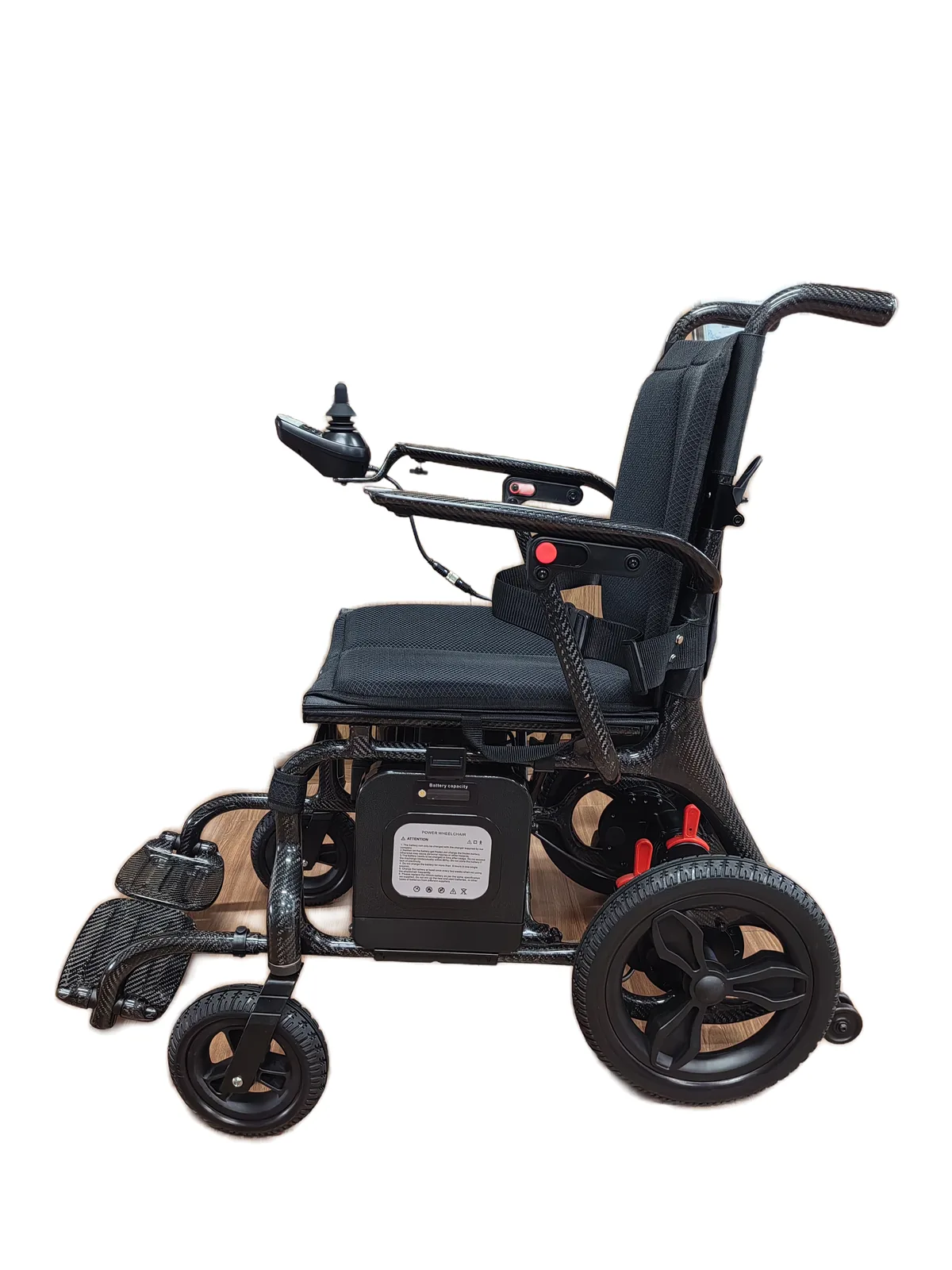 EW1000 carbon fiber electric wheelchair, side view showing under-seat lithium battery box